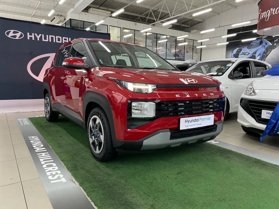 Red Hyundai Exter 1.2 Premium MT displayed at a South African Hyundai dealer
