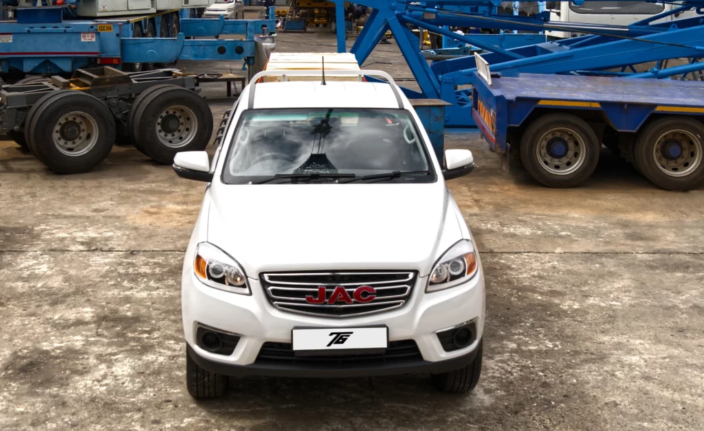 Front view of a white JAC T6 Single Cab in an industrial yard