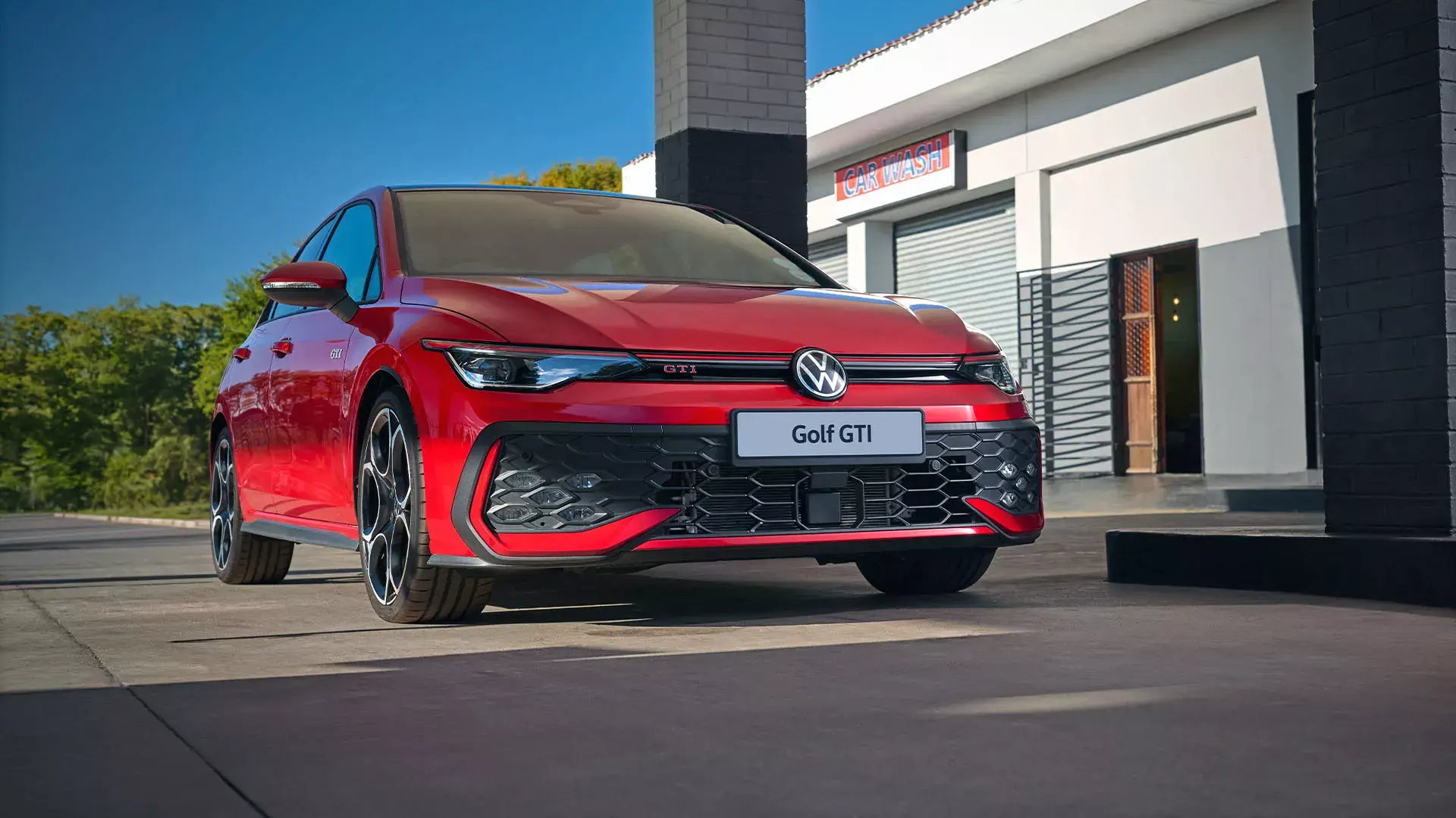 Red Volkswagen Golf GTI 8.5 viewed from the front three-quarter angle